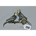 A PAIR OF COLD PAINTED BRONZED BUDGIES PERCHED ON A BRANCH, the underside has areas of glue