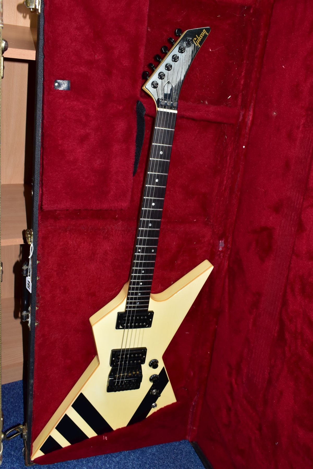 A 1985 GIBSON CUSTOM SHOP XPL EXPLORER GUITAR with a cream finish and black detailing (some