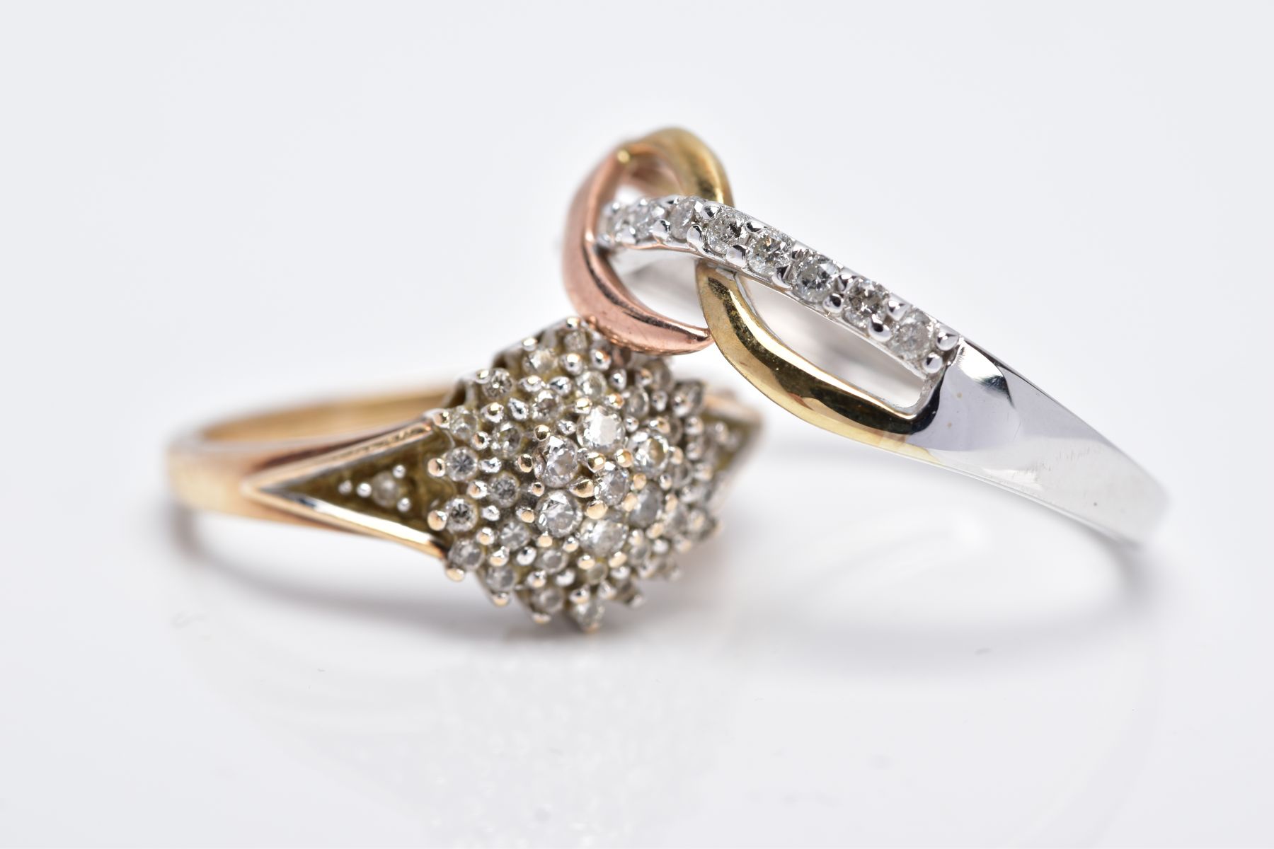 TWO 9CT GOLD DIAMOND RINGS, the first designed as a raised cluster set with round brilliant cut - Image 2 of 3