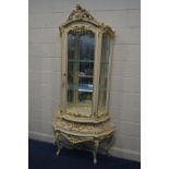 A SILIK BAROQUE STYLE ITALIAN SINGLE DOOR CURIO CABINET, with heavily carved ornate decoration, with