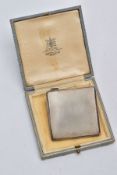 A SILVER COMPACT, square form with an engine turn design, hallmarked Birmingham 1945 'Adie