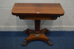 A VICTORIAN ROSEWOOD CARD TABLE, the fold over top enclosing a circular purple baize lining, on a