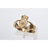 A 9CT GOLD CLADDAGH DIAMOND RING, designed with a star set single cut diamond, on a wide band