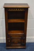 A TITCHMARSH AND GOODWIN SLIM OAK OPEN BOOKCASE with a single shelf, over a single cupboard door,