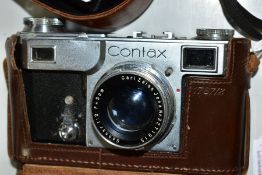 A CONTAX 11 RANGEFINDER CAMERA fitted with a Carl Zeiss Jenar Sonnar 5cm f.1.2 lens, complete with