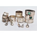 AN ASSORTEMENT OF SILVER NAPKIN RINGS AND SALT SPOONS, to include eight napkin rings of various