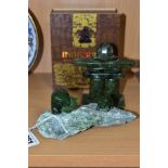 A BOXED INUKSHUK GREEN SOAPSTONE INUIT ABSRACT FIGURE ON A RECTANGULAR PLINTH, height 10.5cm,