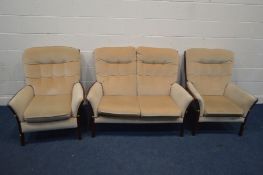 A CREAM UPHOLSTERED AND WOODEN FRAMED THREE PIECE SUITE, comprising a two seater settee, manual