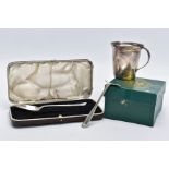 A SILVER JUG AND A CASED BABY FEEDIING SET, the silver jug of a plain polished tapered design fitted