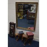 TWO ELEPHANT SHAPED HARDWOOD STOOLS/SEATS, together with a modern giltwood bevelled edge wall