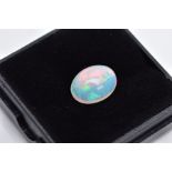 A LOOSE OPAL OVAL CABOCHON CUT STONE, measuring 12.5mm x 9.3mm, weighing approximately 3.30ct