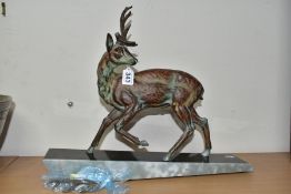 AN ART DECO PATINATED SPELTER STAG, one antler detached, (the other with repair and s.d) mounted