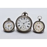 THREE SWISS SILVER OPEN FACED POCKET WATCHES, to include a larger pocket watch with a white dial,