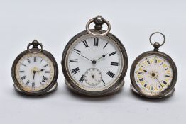 THREE SWISS SILVER OPEN FACED POCKET WATCHES, to include a larger pocket watch with a white dial,