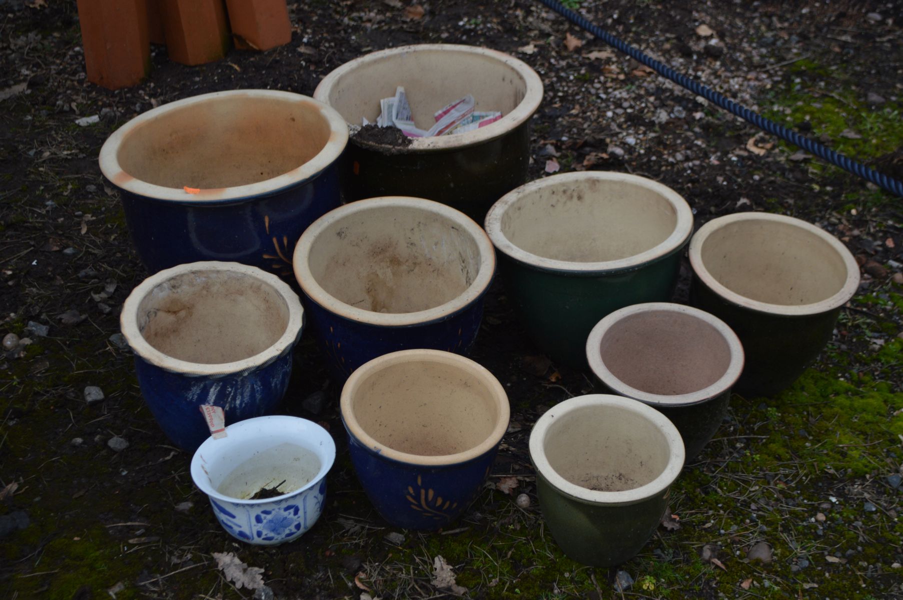 A COLLECTION OF GLAZED CERAMIC GARDEN POTS, four blue, the biggest diameter 38cm x height 35cm, five