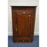 A GEORGIAN OAK AND CROSSBANDED HANGING CORNER CUPBOARD, with a single drawer, width 76cm x depth