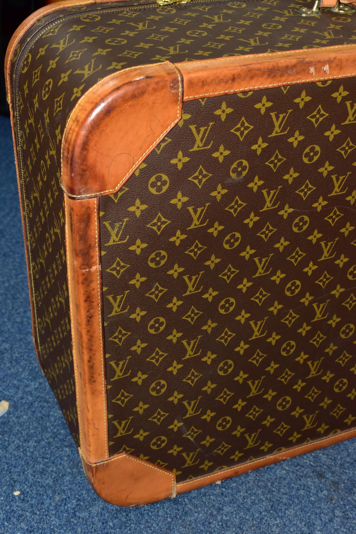 A LOUIS VUITTON MONOGRAM SUITCASE, tan leather trim, with a combination lock (locked, combination - Image 16 of 17