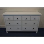 A MODERN WHITE FINISH SIDEBOARD/CHEST OF FOUR SHORT OVER FOUR LONG DRAWERS, width 162cm x depth 51cm