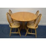 A MODERN BEECH CIRCULAR KITCHEN TABLE, diameter 107cm x height 76cm and four spindle back chairs (