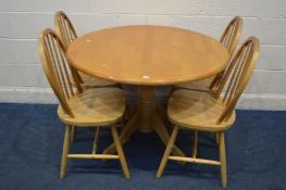 A MODERN BEECH CIRCULAR KITCHEN TABLE, diameter 107cm x height 76cm and four spindle back chairs (
