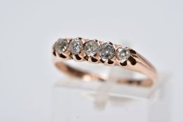 A YELLOW METAL FIVE STONE DIAMOND RING, designed with a row of five, claw set old cut diamonds,