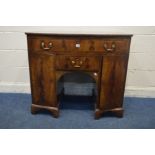 A GEORGIAN MAHOGANY, CROSSBANDED AND STRUNG BOWFRONT SIDEBOARD, with a single long oak lined