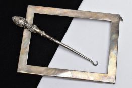 A SILVER FRAME AND A BUTTON HOOK, the plain polished rectangular frame, hallmarked Birmingham