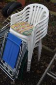 A SET OF SIX WHITE PLASTIC GARDEN STACKING CHAIRS together with two metal framed folding deck chairs