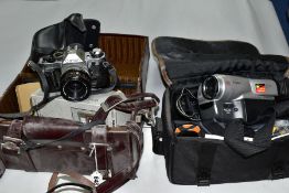 A CANON AE-1 PROGRAM fitted with a 50mm f1.8 lens, soft case, Fotomatic Flash in a bag and a Canon