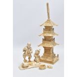 A LATE 19TH CENTURY JAPANESE IVORY OKIMONO OF A VEGETABLE VENDOR AND A YOUNG BOY MOUNTED ON A