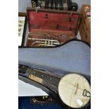 A HAWKES AND SONS EXCELSIOR SONOROUS CORNET in case, a vintage and unbranded ukele banjo and a The