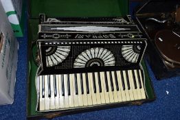 A CASED PAULO SOPRANI ACCORDIAN, with diamante detailing on black and white case