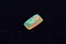 A LOOSE OPAL RECTANGULAR SHAPED CABOCHON CUT STONE, measuring approximately 12.0mm x 6.5mm, weighing
