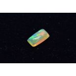 A LOOSE OPAL RECTANGULAR SHAPED CABOCHON CUT STONE, measuring approximately 12.0mm x 6.5mm, weighing