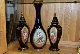 A PAIR OF LIMOGES VASES AND COVERS, with hand painted floral panels and gilt detailing on a dark
