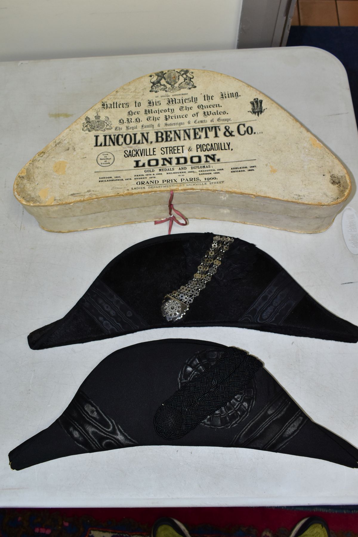 A BICORN HAT BY LINCOLN, BENNETT & CO, together with hat box with printed information for Lincoln