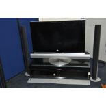 A Bang & Olufsen Beovision 7 - 40 40ins tv on motorised moving stand with connected sub-woofer and