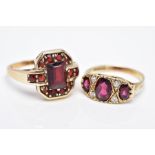 TWO 9CT GOLD GEM SET RINGS, the first designed with three graduated oval cut garnets, within a