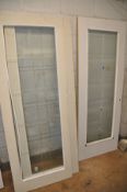 A COLLECTION OF SEVEN INTERIOR DOORS to include two cream with a single glaze panel, width 74.5 (