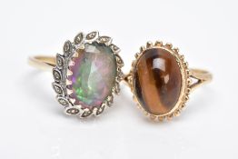TWO 9CT GOLD GEM SET RINGS, to include a tiger eye cabochon, within a collet mound and a beaded