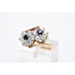 A 9CT GOLD SAPPHIRE AND CUBIC ZIRCONIA DOUBLE CLUSTER RING, designed with two asymmetrical clusters,