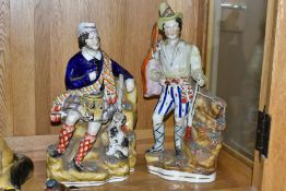 A STAFFORDSHIRE STYLE FIGURE OF A HUNTER WEARING HIGHLAND DRESS, HIS DOG AND RIFLE BESIDE HIM,