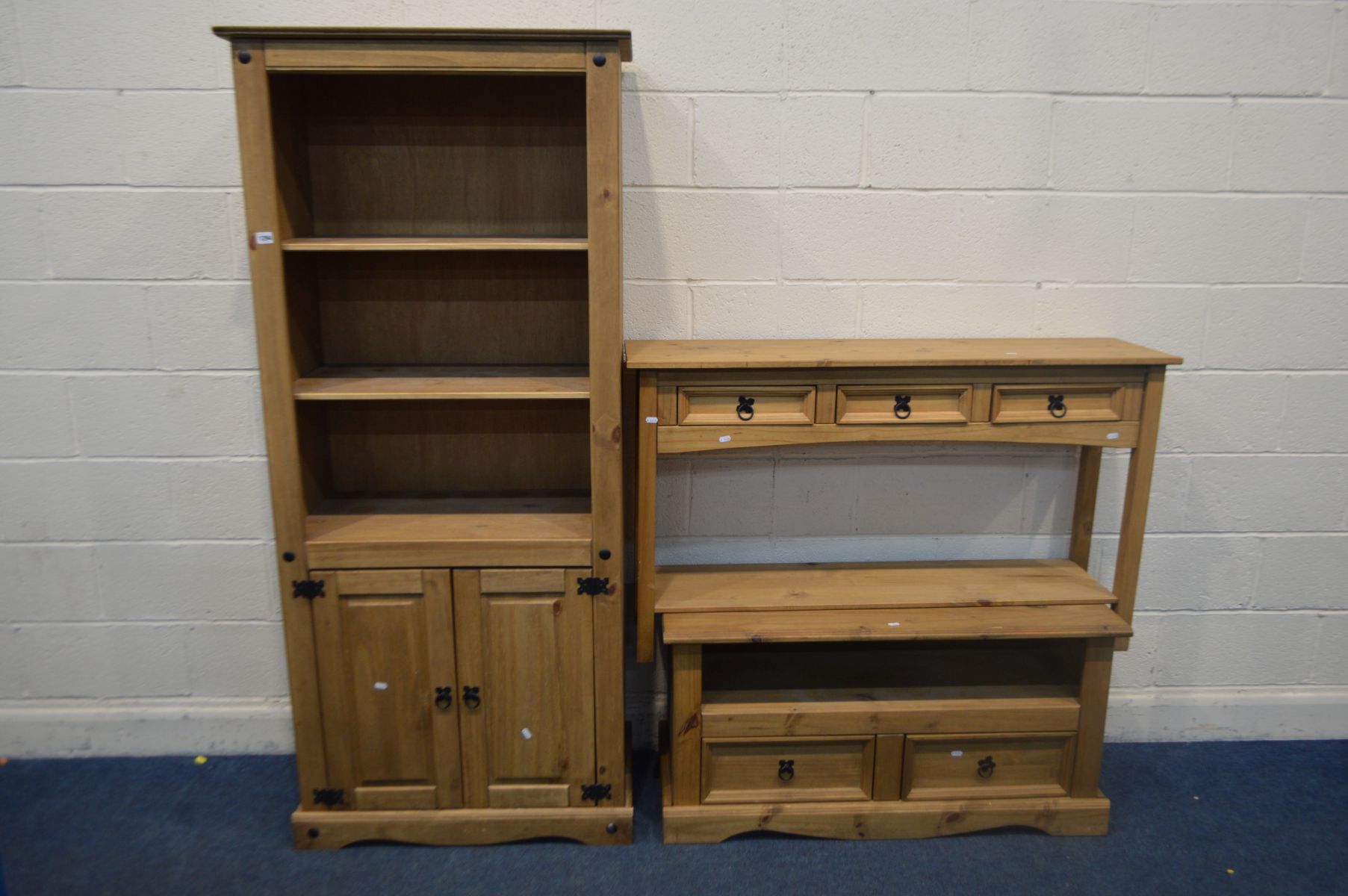 A CORONA PINE OPEN BOOKCASE with double cupboard doors, width 81cm x depth 44cm x height 183cm, a