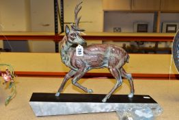 AN ART DECO PATINATED SPELTER STAG, one antler detached, (the other with repair and s.d) mounted