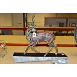 AN ART DECO PATINATED SPELTER STAG, one antler detached, (the other with repair and s.d) mounted