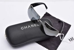 A PAIR OF LADIES CHANEL SUNGLASSES, black tinted lenses, signed in the top corner 'Chanel', black