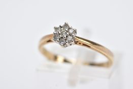 A 9CT GOLD DIAMOND RING, designed with a small cluster set with seven round brilliant cut