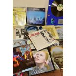 TWENTY LP'S BY DAVID BOWIE AND GENESIS along with attributing artists and a framed Silver Disc for