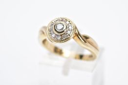 A 9CT GOLD DIAMOND RING, designed with a circular head with a central collet set round brilliant cut