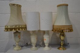 THREE VARIOUS ONYX TABLE LAMPS, and a brass table lamp, all with fabric shades (4)